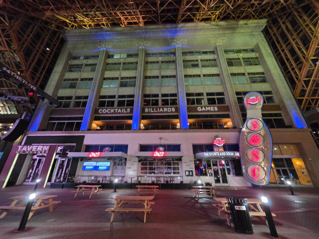 Illuminated city venue and structural details after dark