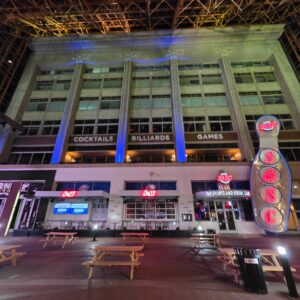 Illuminated city venue and structural details after dark